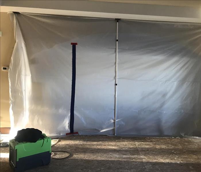 SERVPRO equipment connected to containment over mold damage