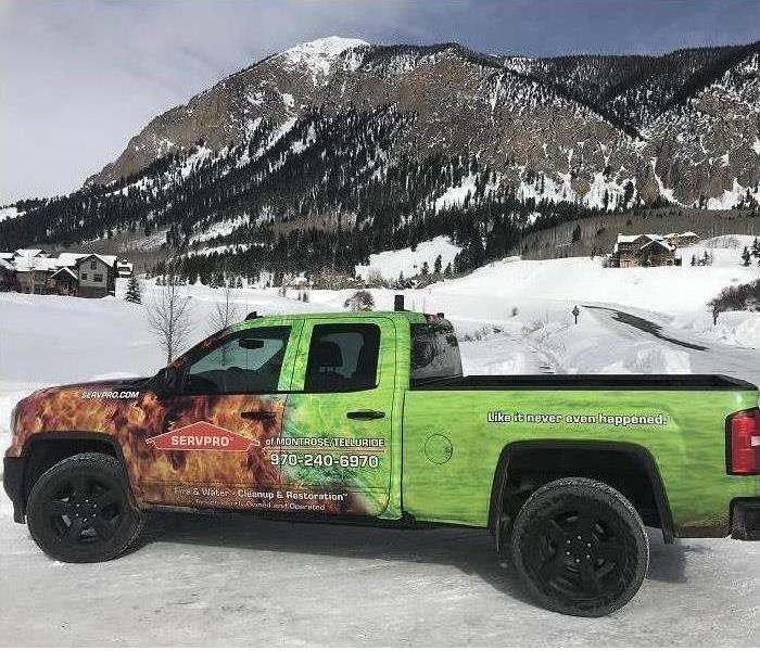 SERVPRO truck posed in front of snow covered mountains