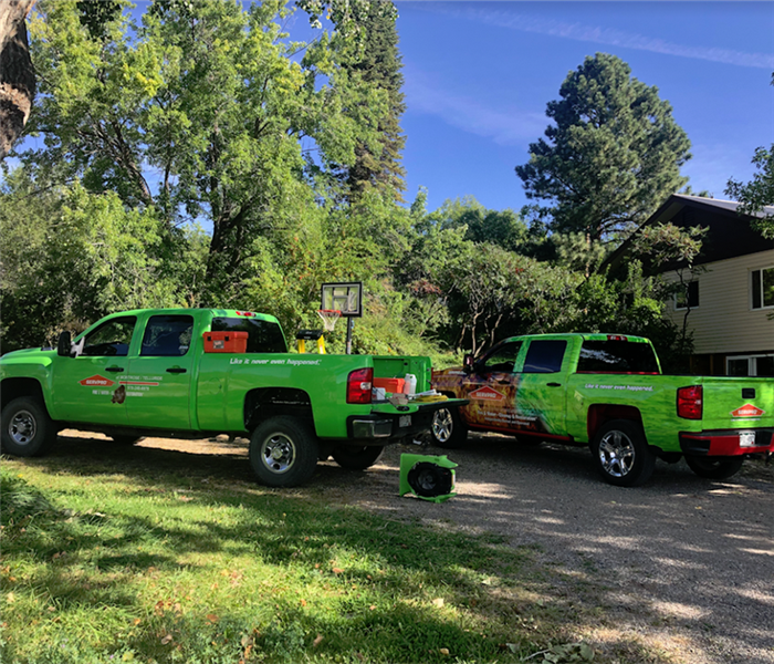 SERVPRO vehicles outside of a house