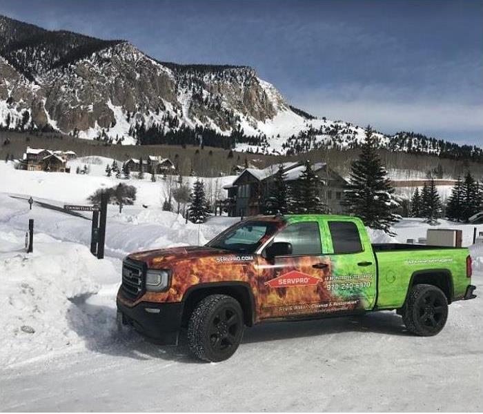 SERVPRO truck with snow covered mountain in background